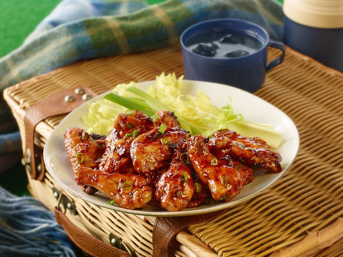 Glazed chicken wings with celery