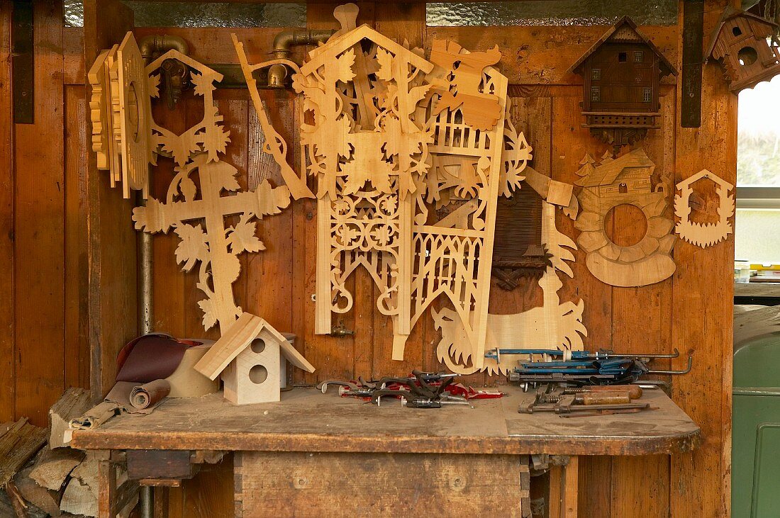 Clock fronts and templates for cuckoo clocks in traditional workshop