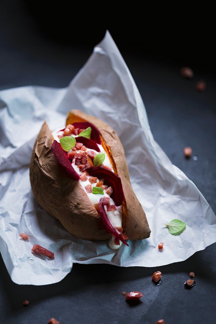 Stuffed sweet potato with ricotta, bacon and beetroot