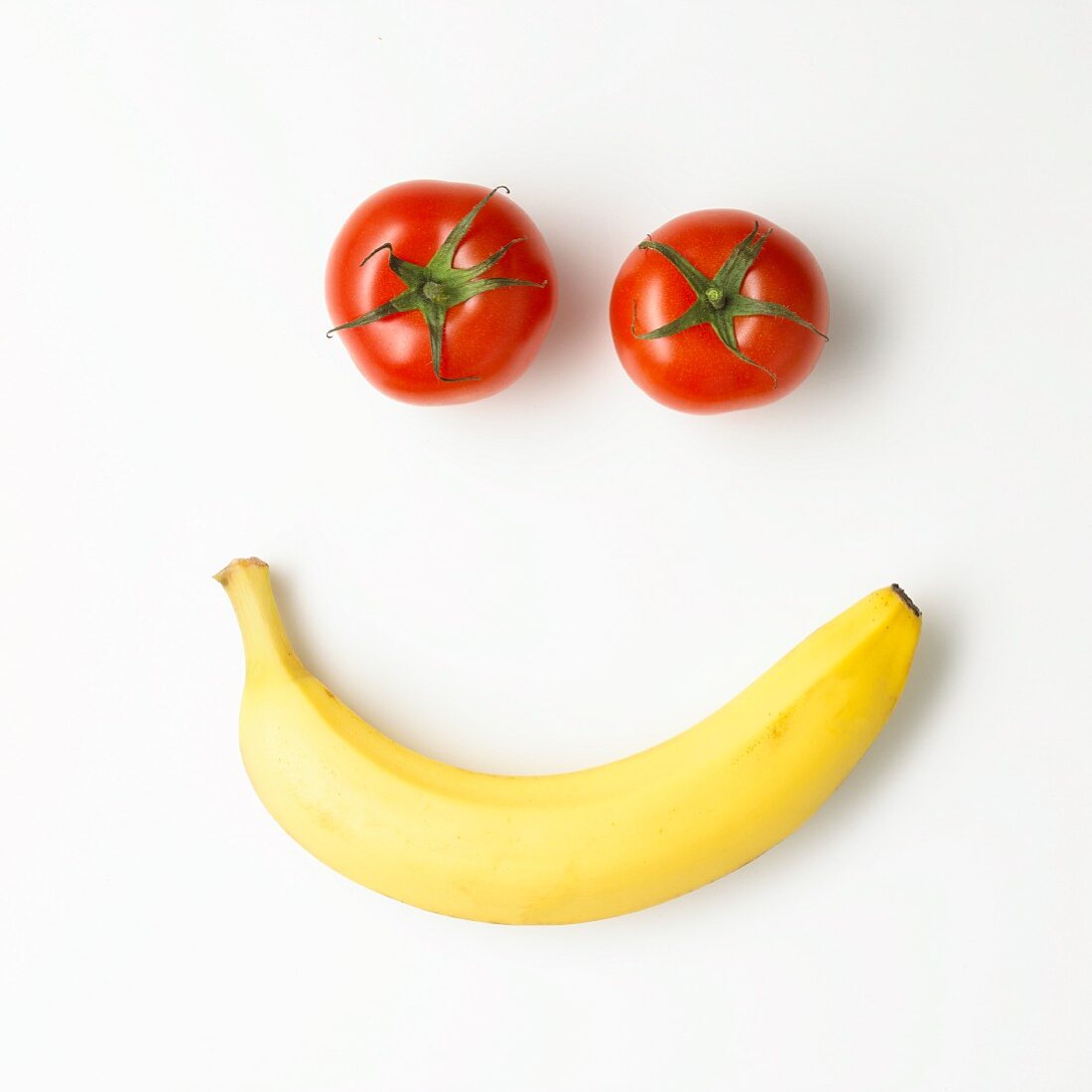 Gesicht aus Tomaten und Banane