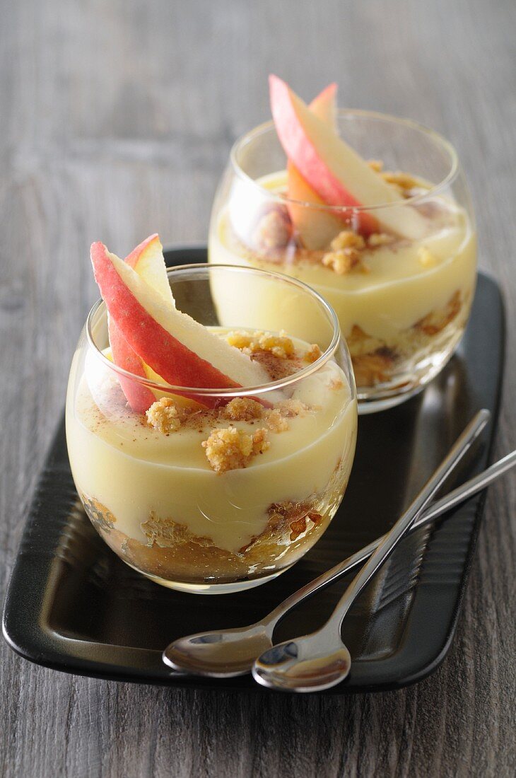 Apple tiramisu with crumble in dessert glasses