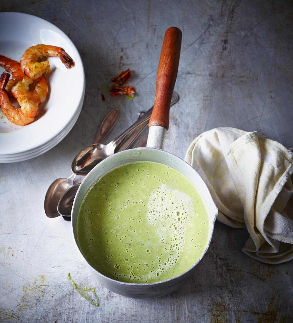 Cream of pea soup with prawns