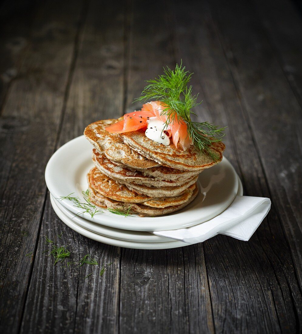 A stack of blinis with smoked salmon