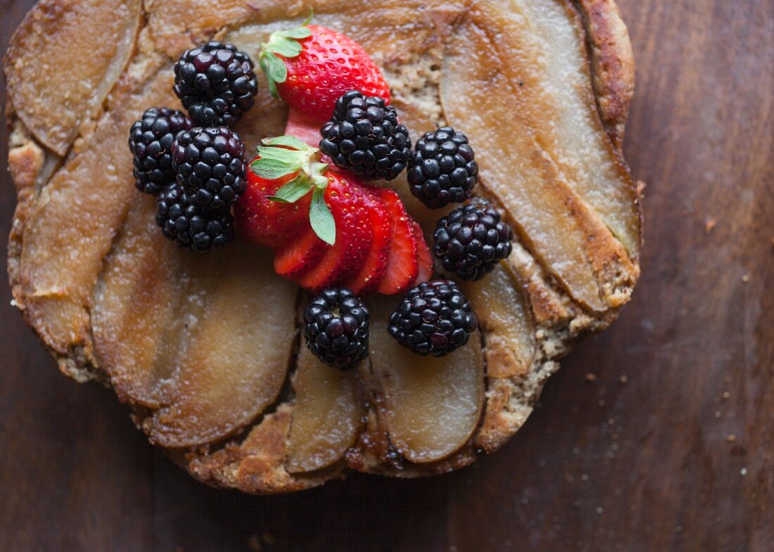 Organic, gluten-free pear tart with fresh berries