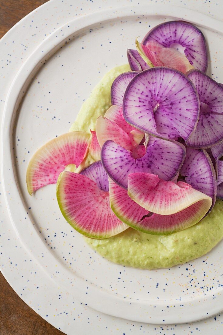 Sliced radiches with avocado and tomatillo sauce