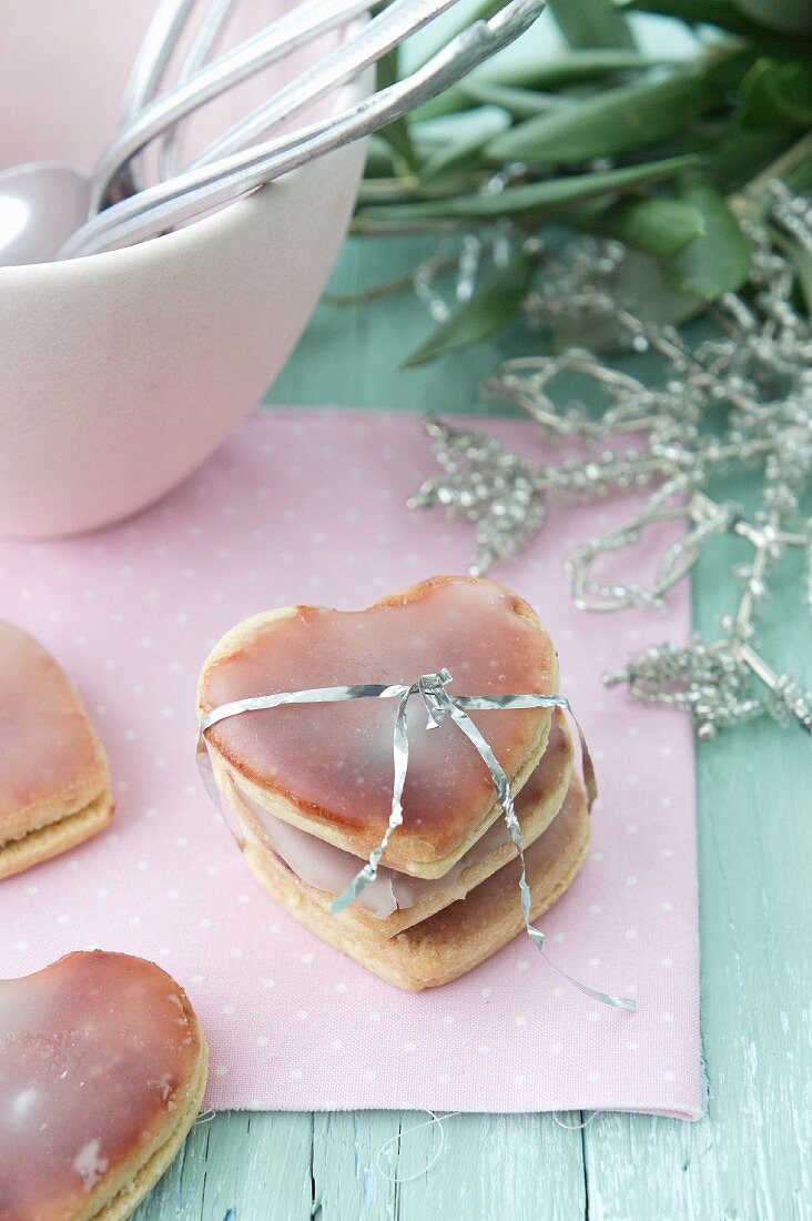 Heart-shaped biscuits covered with jam