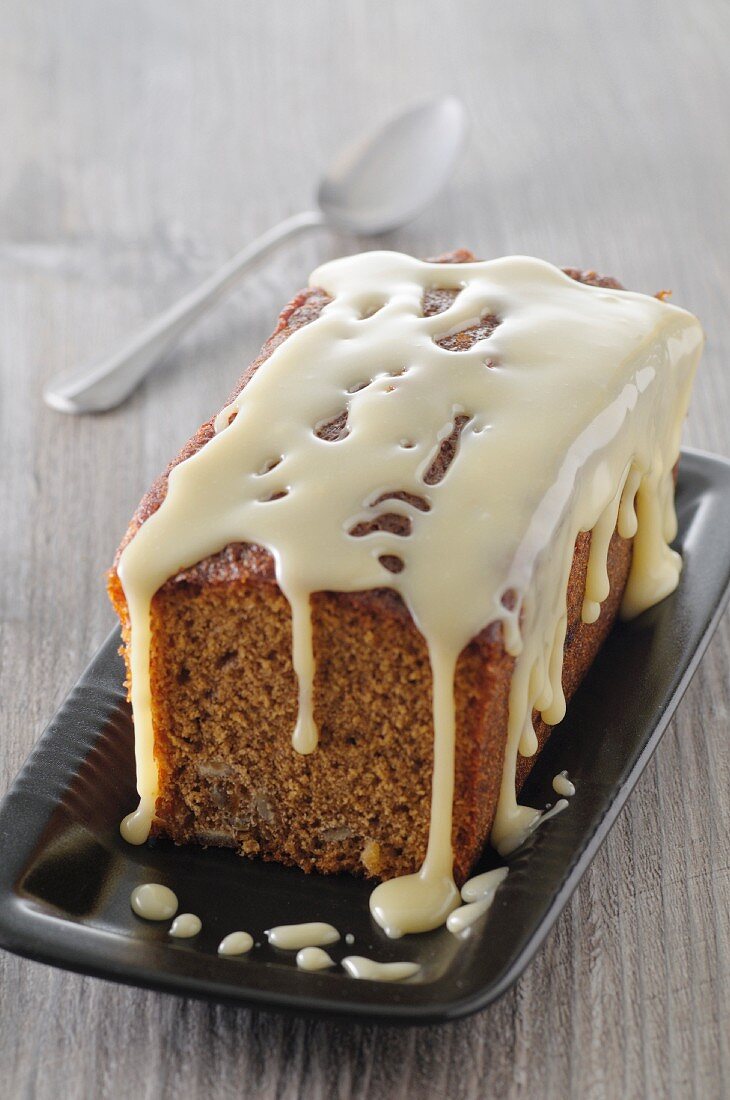 Loaf cake with white chocolate glaze, sliced