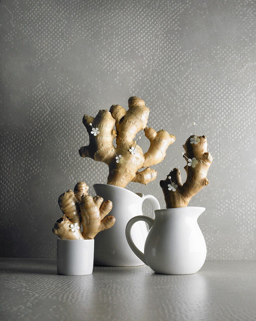 An arrangement of ginger roots and paper flowers