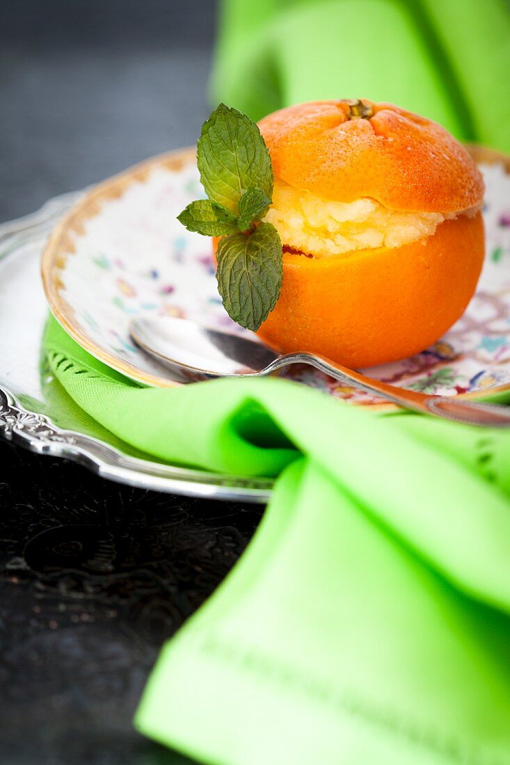 Mandarin sorbet served in hollowed out orange