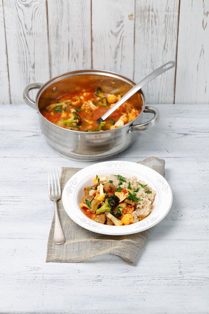 Pork stew with vegetables served with pearl barley