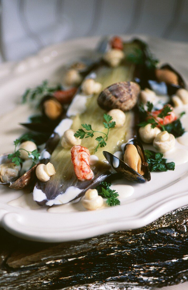 Aubergines with seafood and mushrooms