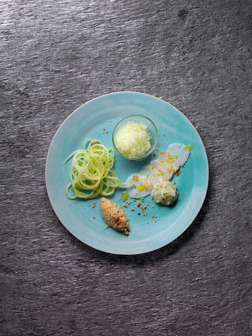 Variations of scallops with cucumber spaghetti, mushroom quinoa and gin and tonic granita