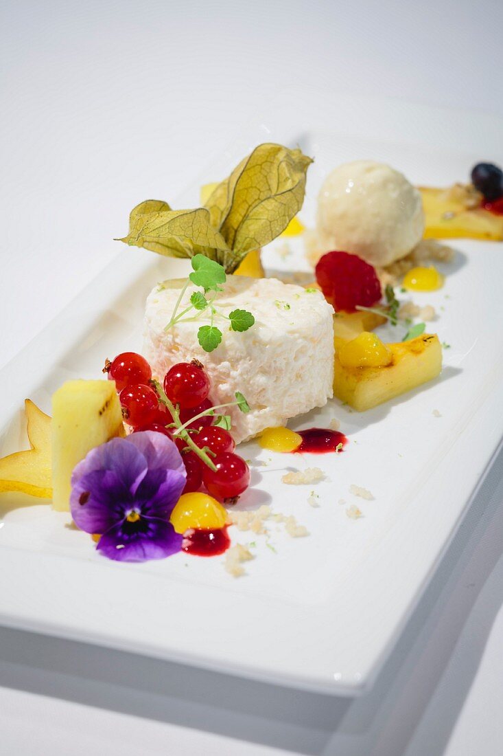 Lychee mousse with roasted mango ice cream and tropical fruit