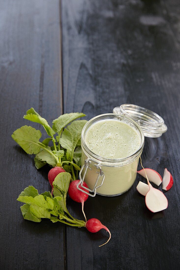 A radish and cucumber smoothie in a jar