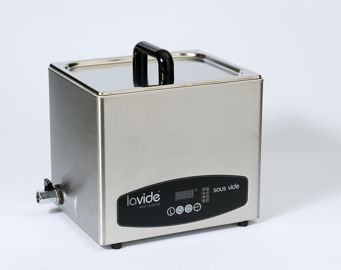 A sous vide machine on a white surface