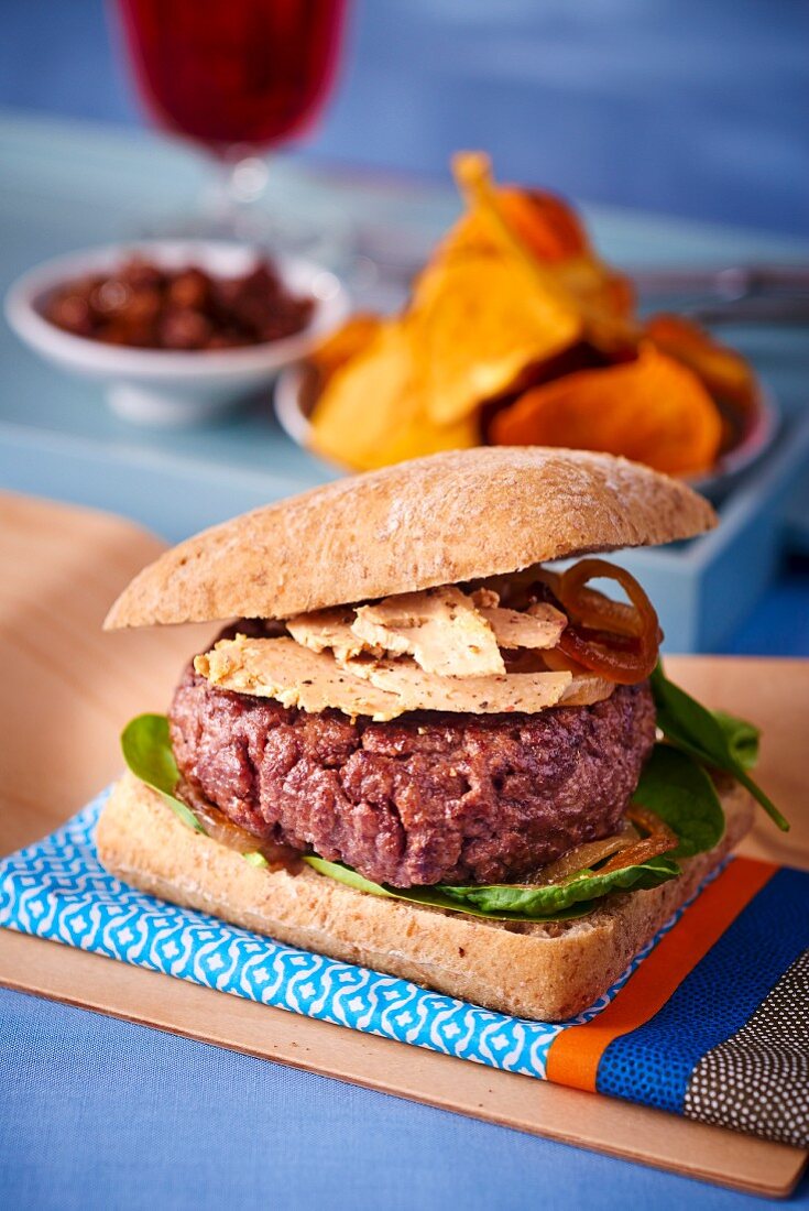 A rossini burger with vegetable crisps