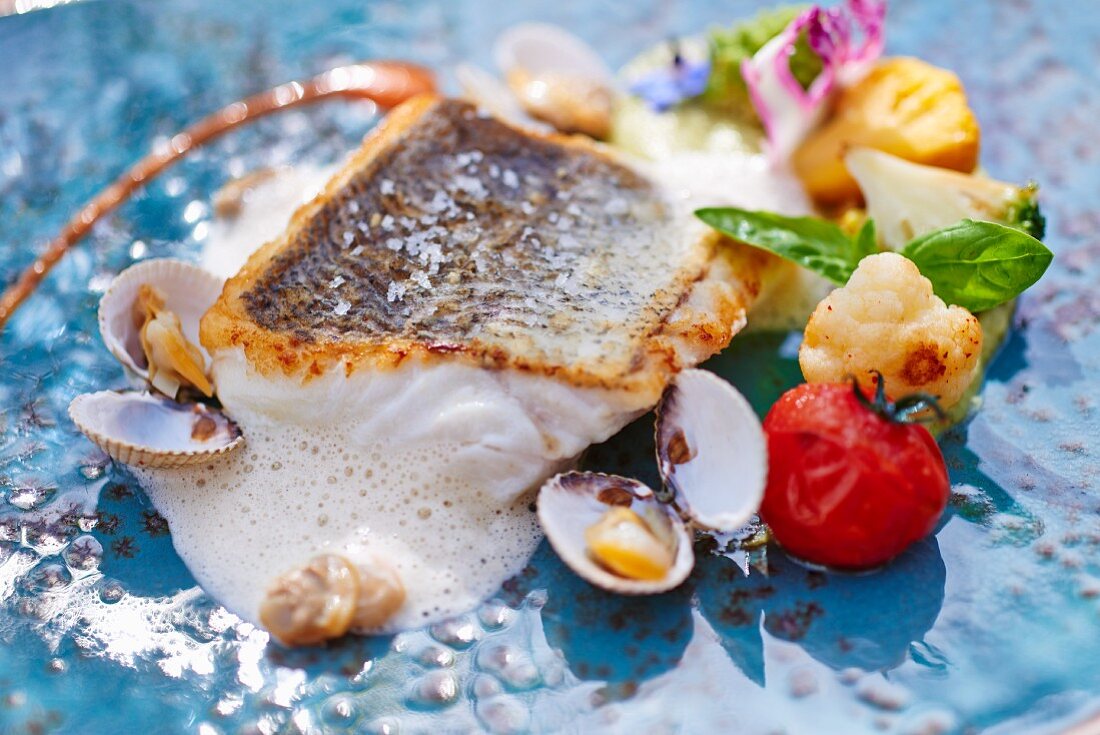 Hake with clams and vegetables