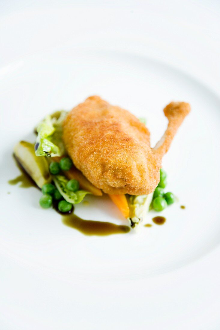 Roast chicken on cooked lettuce with pumpkin seed oil
