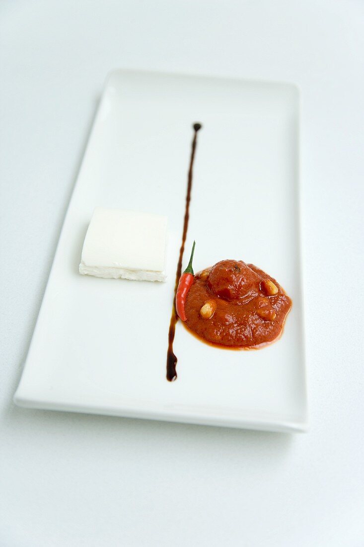 Tomato and chilli chutney with goat's cream cheese