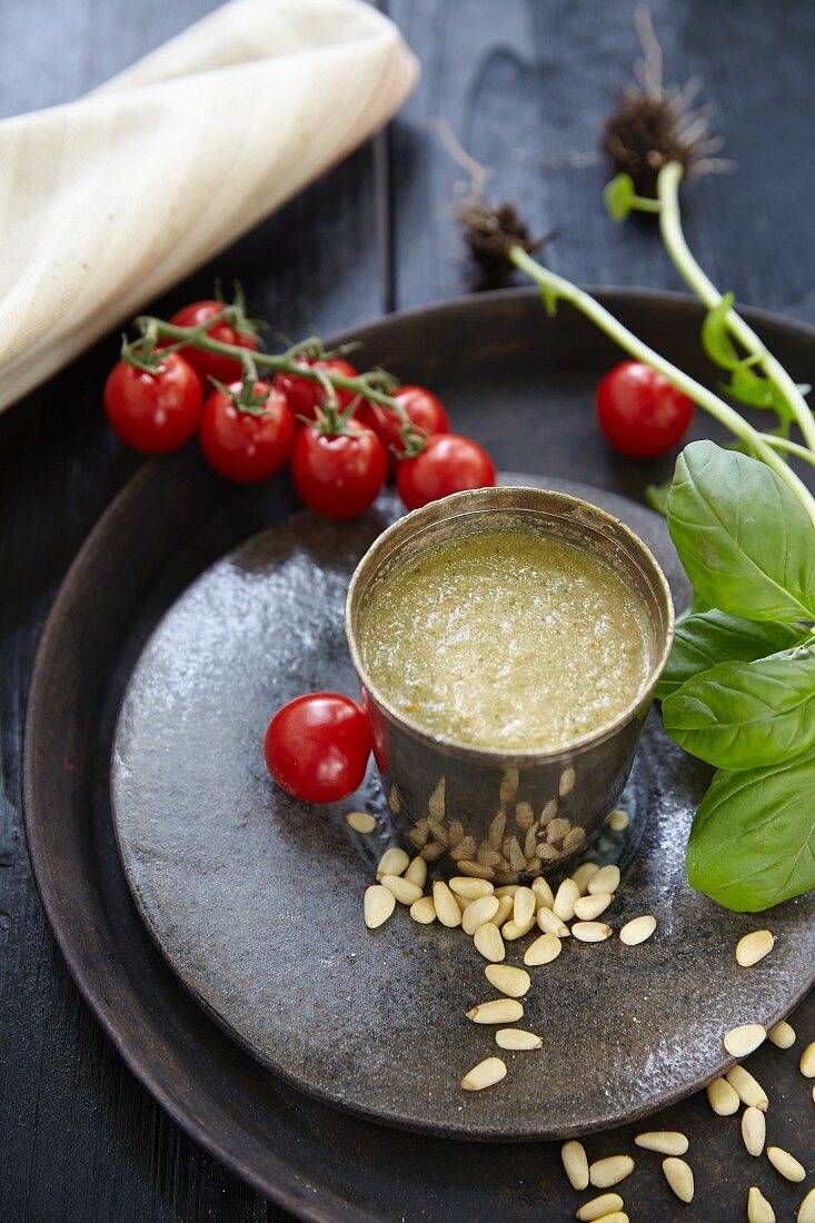 A fresh tomato drink with pine nuts and basil