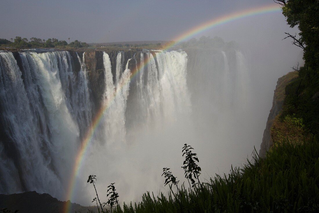 A rainbow over the Victoria Falls, Zambia and Zimbabwe, Africa