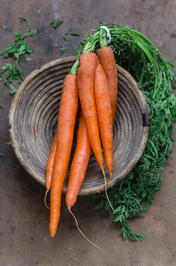 A bundle of carrots in a bowl