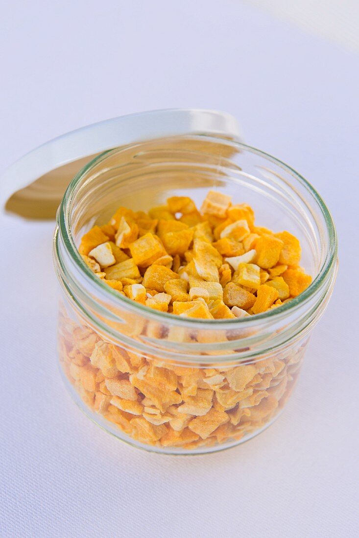 Freeze dried mango pieces in a jar