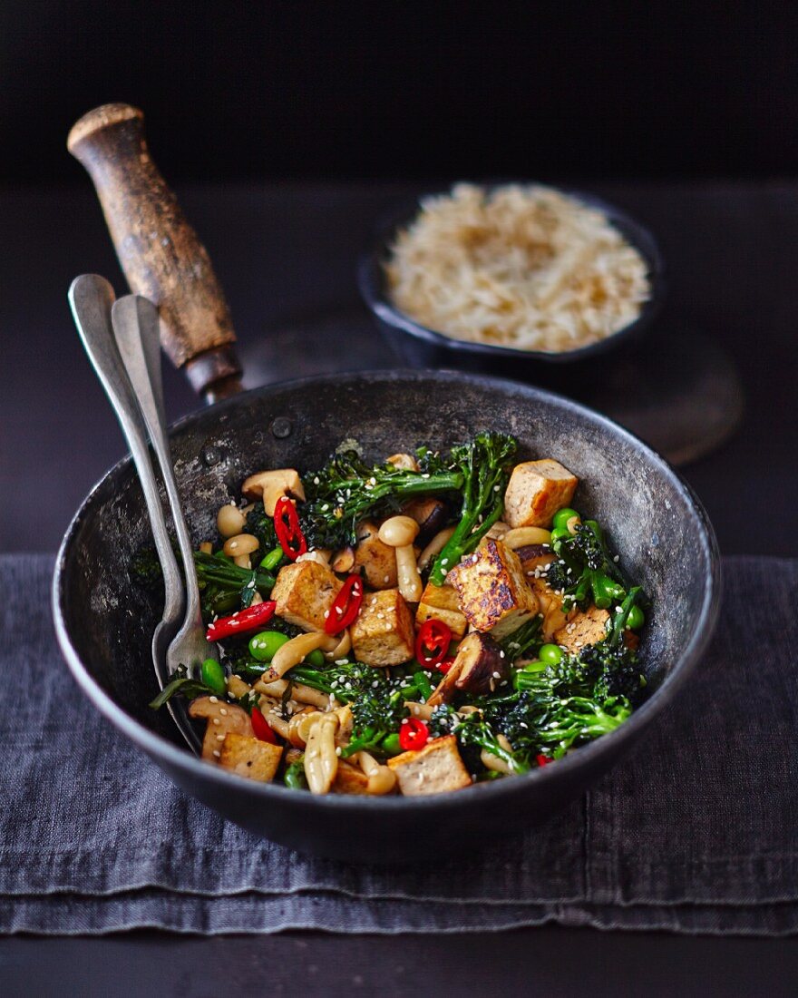 Stir-fried tofu with broccoli, mushrooms, chilli and sesame seeds