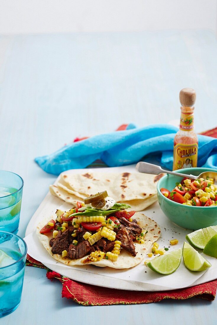 Wheat tortilla with beef and tomato-corn salsa