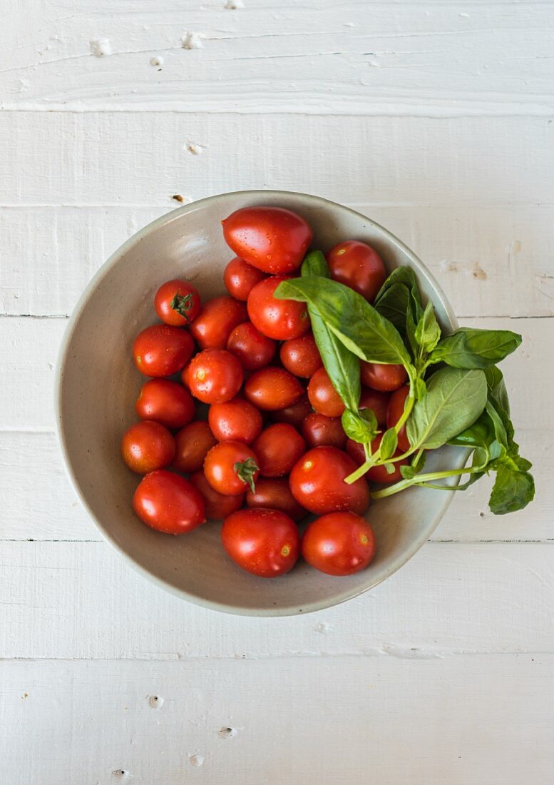 Tomatoes and basil in a bowl