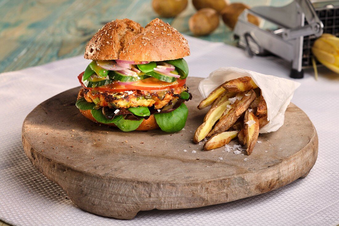 A veggie burger with potato wedges