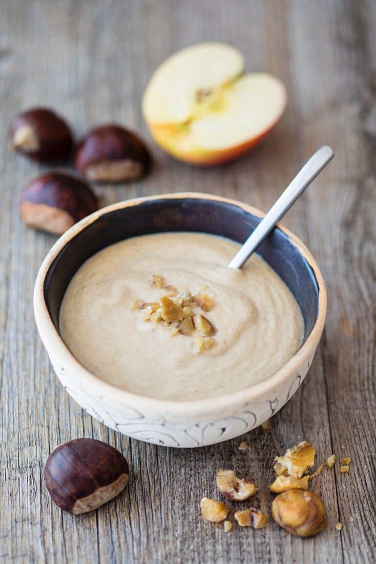 A smoothie bowl with chestnuts and apple