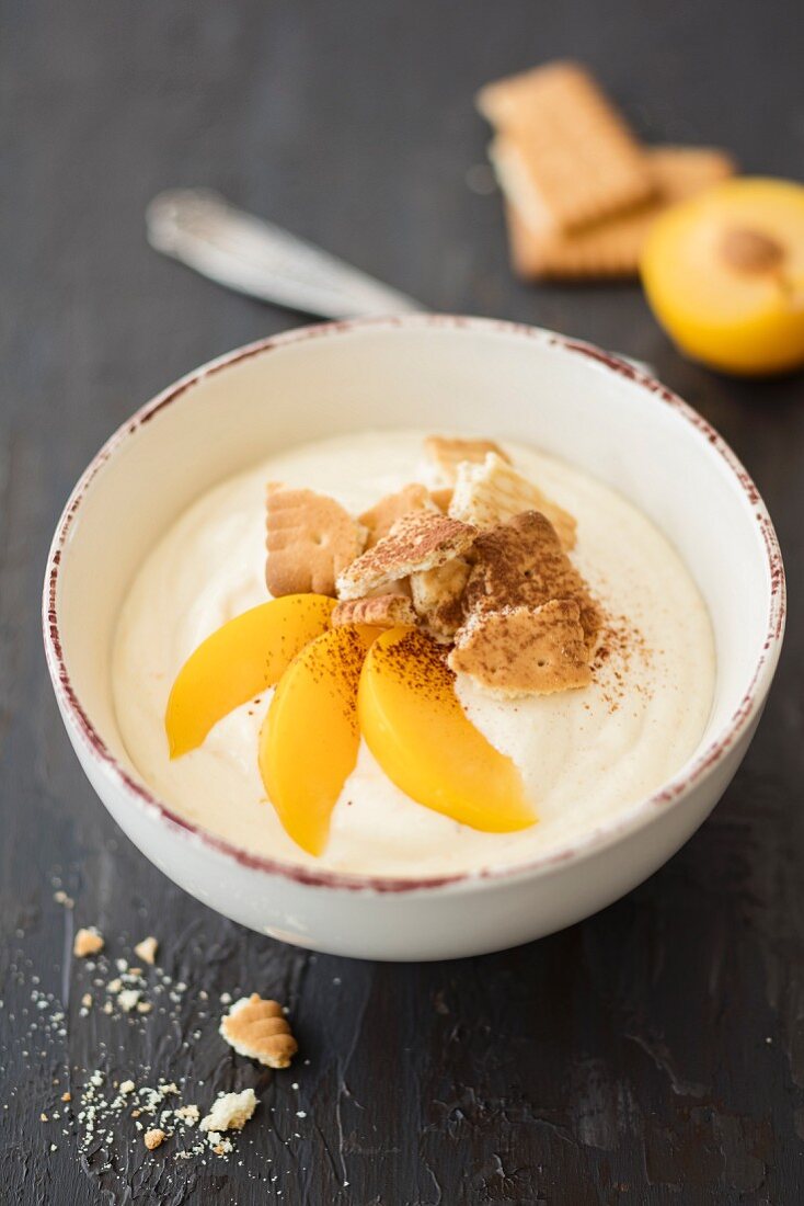 A smoothie bowl wth yellow plums and buttery biscuits