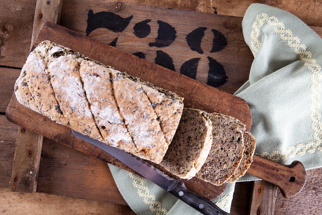 Spelt and wild garlic bread with flax seeds, sliced