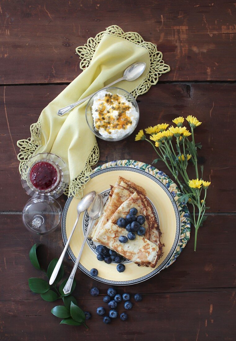 Vanilla crepes with blueberries, cottage cheese and passion fruit
