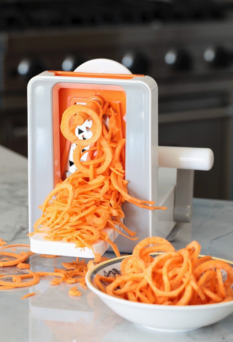 Carrots being cut into spirals