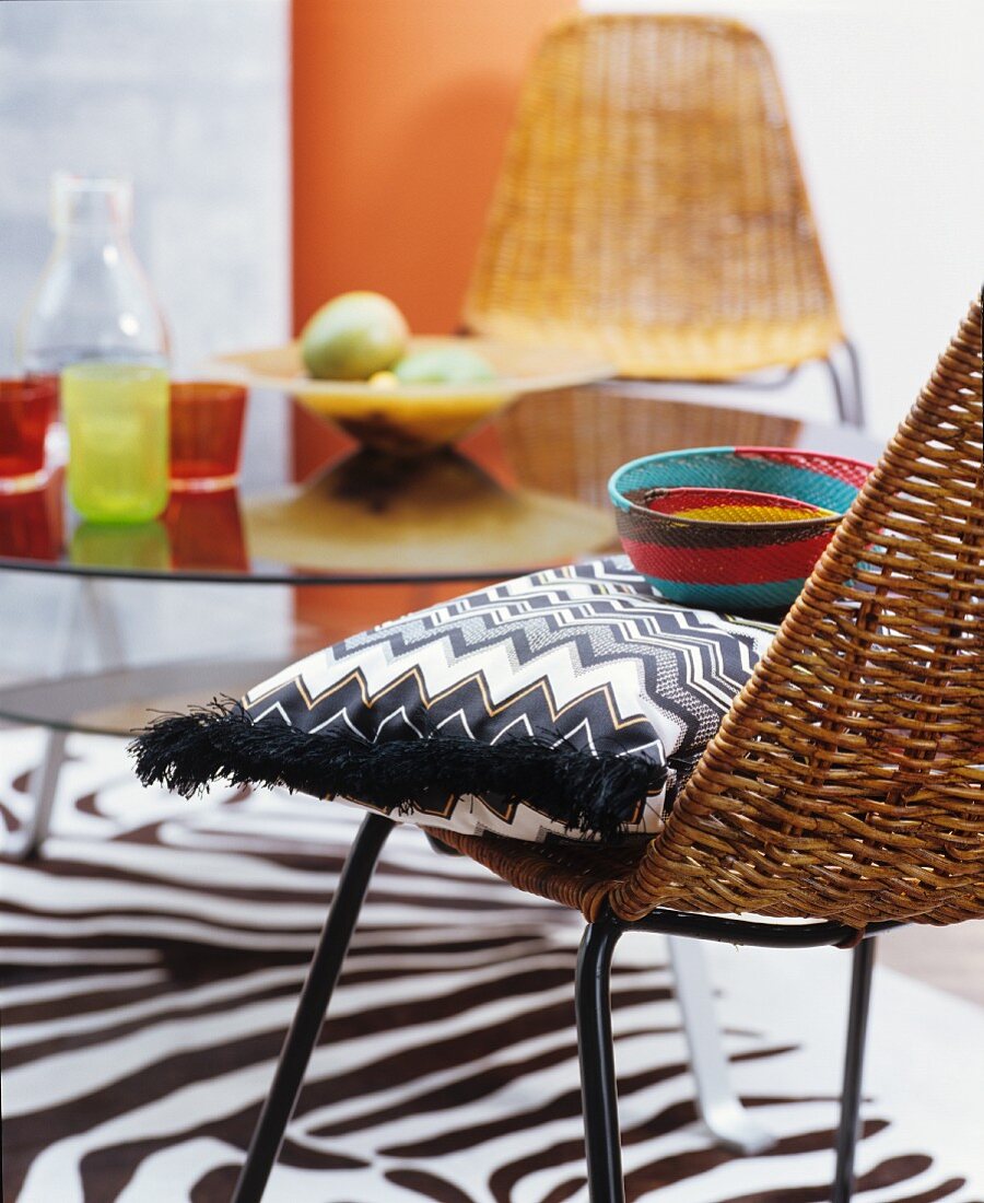 Zigzag-patterned cushion on wicker chair