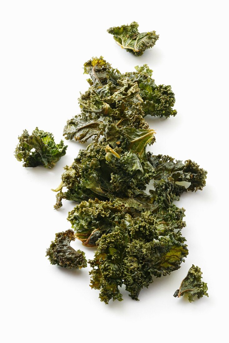 Kale chips on a white surface