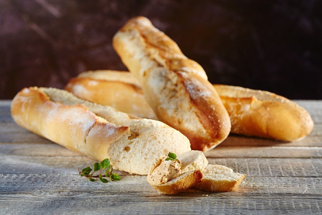 French wheat baguettes with a dip and oregano