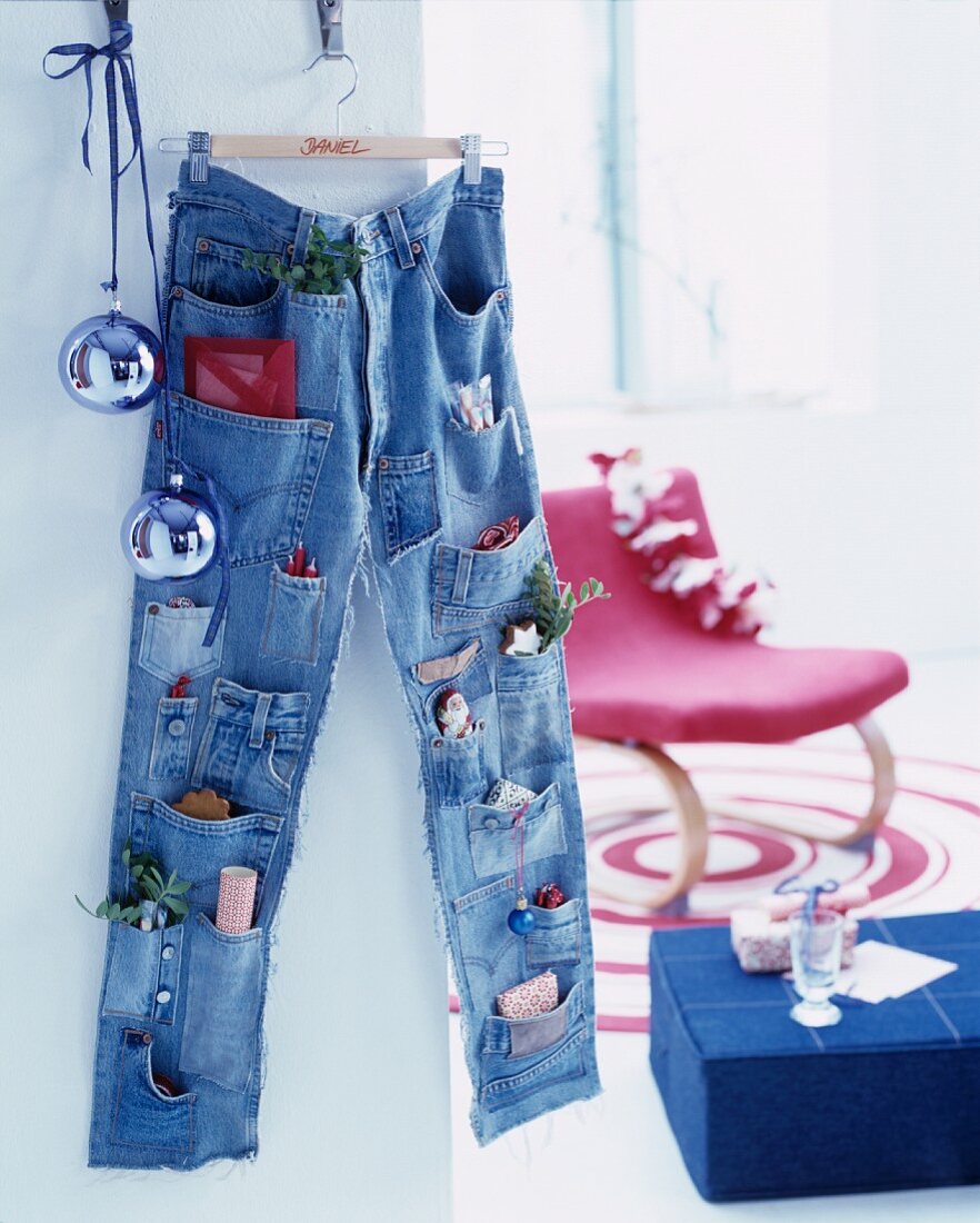 Advent calender made from pair of jeans with pockets sewn onto legs