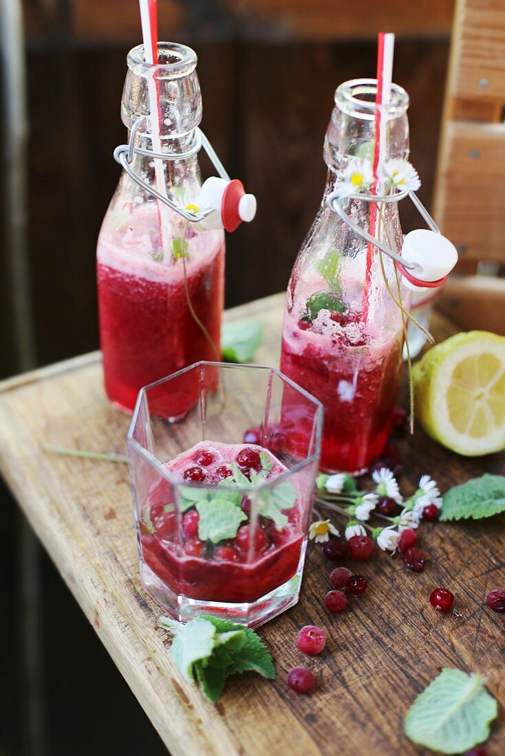 Cold cranberry lemonade on a garden table