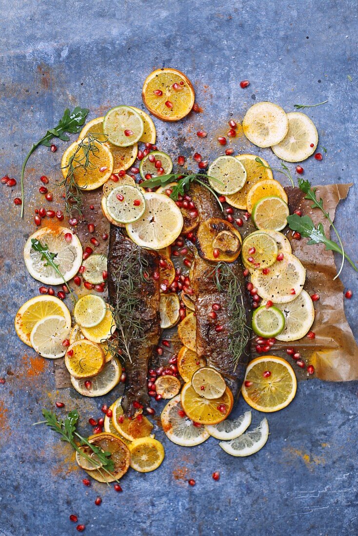 Oven-baked trout with oranges, lemons and limes