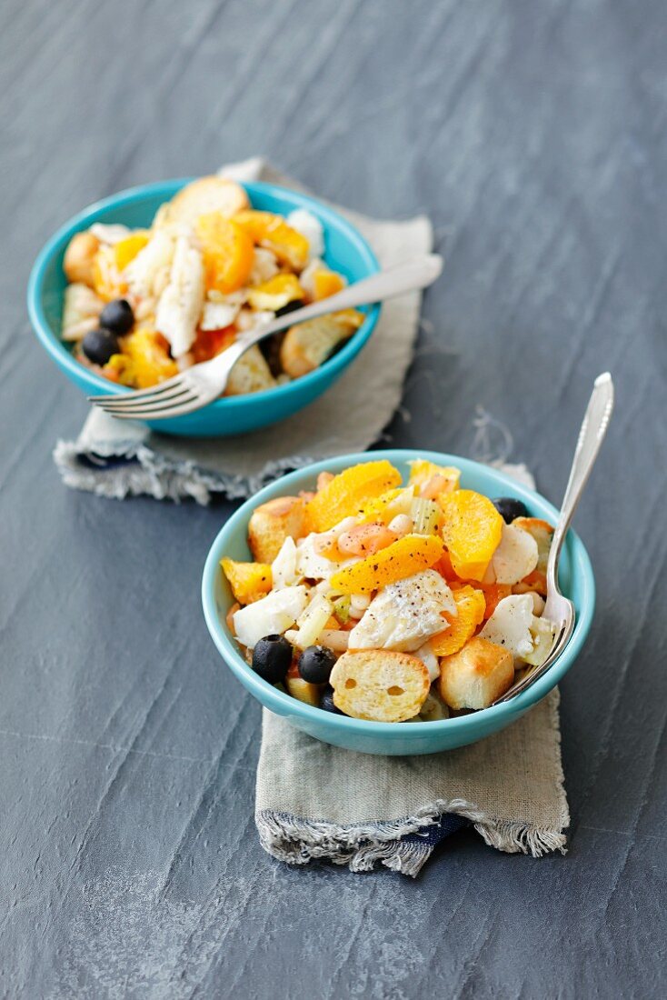 Cod salad with white beans, oranges, olives, tomatoes and croutons