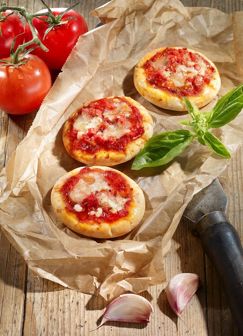 Mini pizzas with tomato sauce and cheese