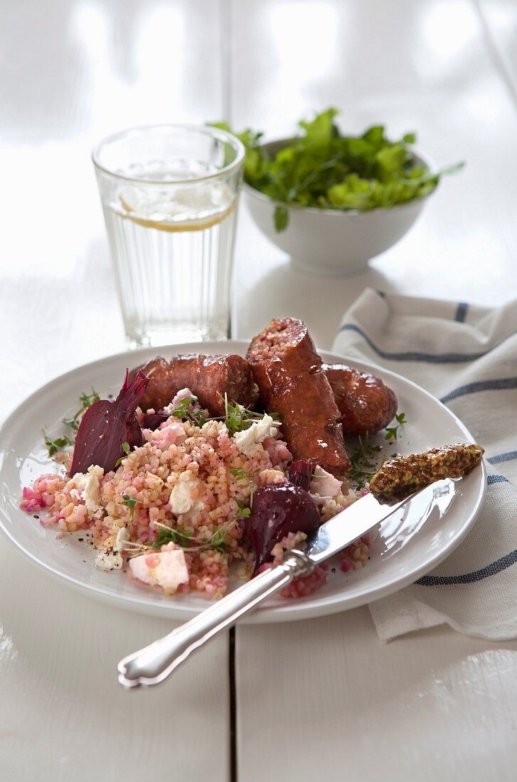 Smoked sausages with bulgur, feta cheese and beetroot