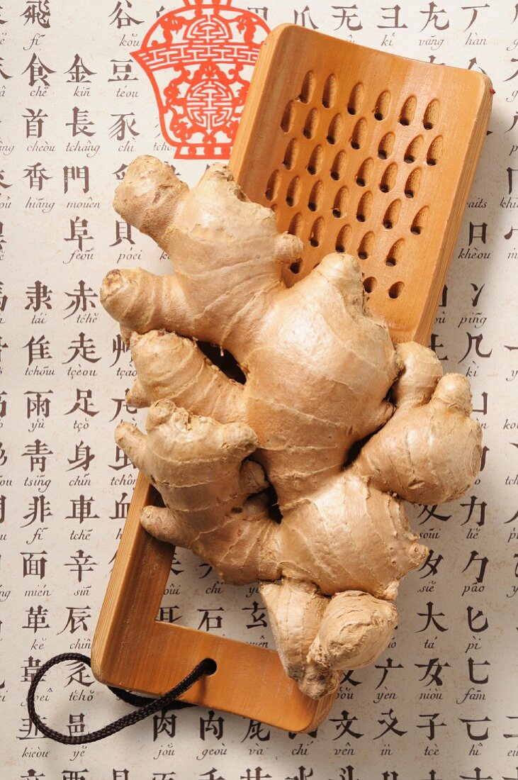 Fresh ginger on a wooden grater