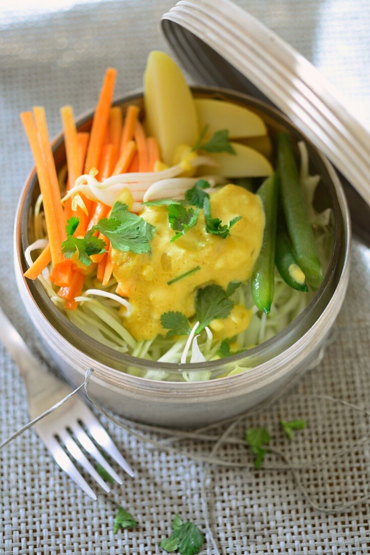 Potatoes and beans with coconut and peanut sauce