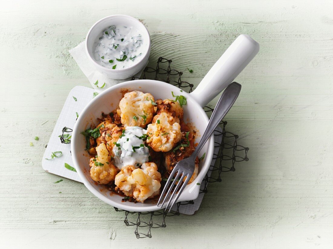 Spicy cauliflower with almonds and herb cream