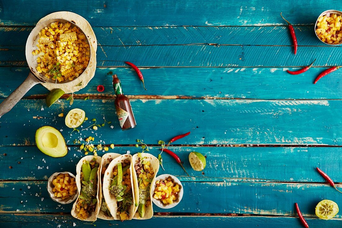 Soft shell tacos with grilled sweet corn, spicy black eye beans, cashew nut cream and a pineapple and chilli salsa (Mexico)