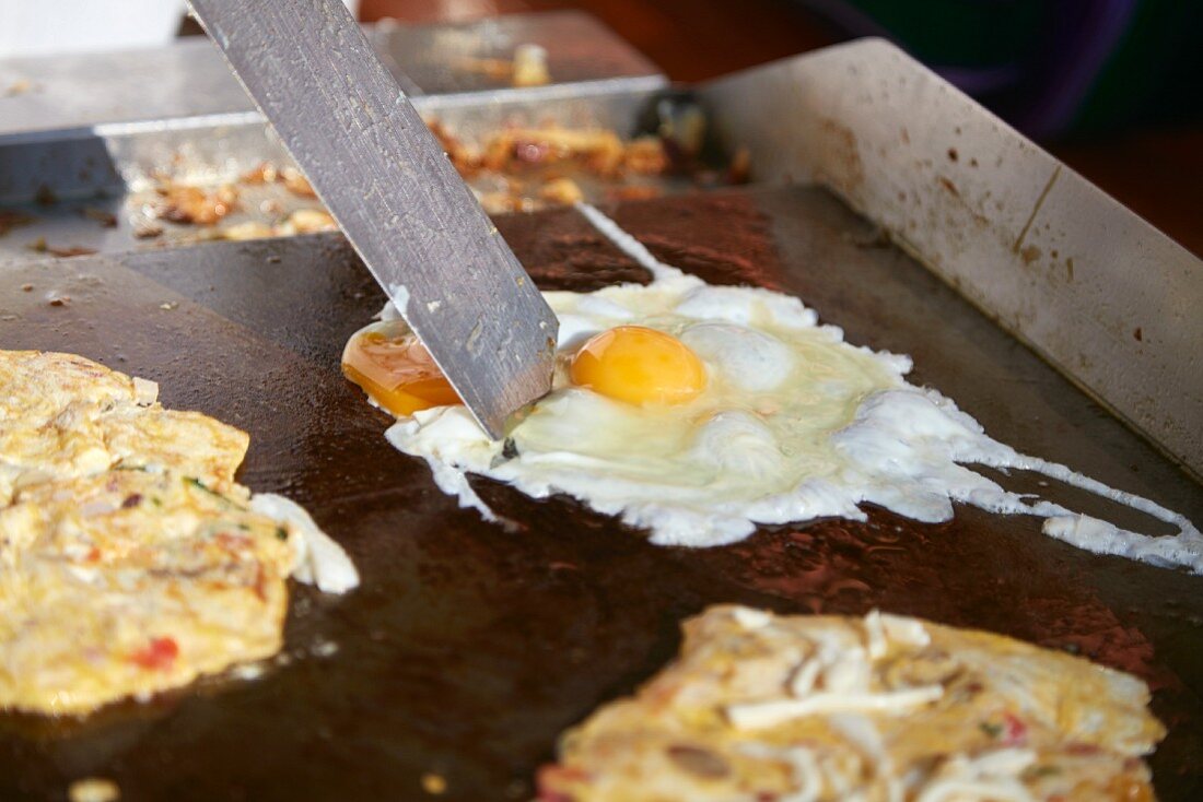 Fried eggs being made (Puerto Vallarta, Mexico)